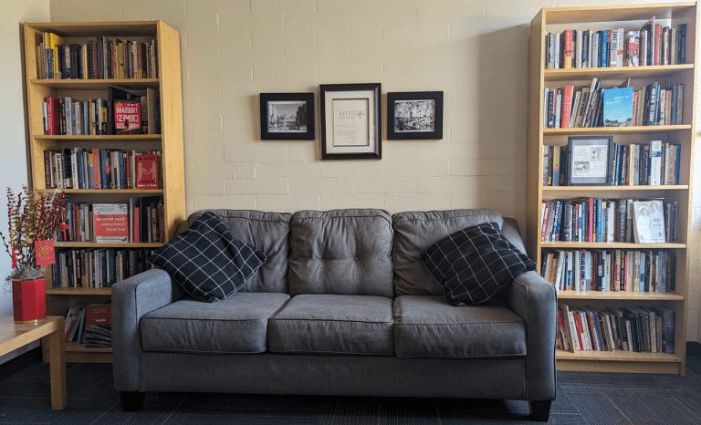 Sofa, bookcase and photos inside CAPAS